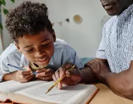 child reading with father child reading with father Bigstock image