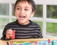 Boy playing board game Boy playing board game