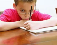 SEN child writing SEN child writing