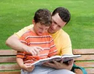 Dad reading with son Dad reading with son