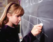 Girl practising writing Girl practising writing