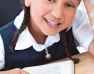 Girl reading at her desk Girl reading at her desk