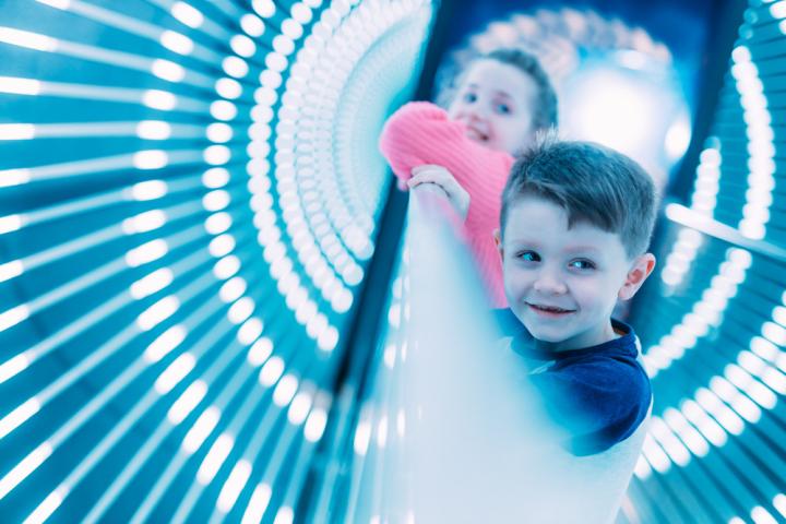 Children in light tunnel