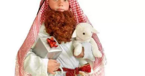 Child wearing a handmade nativity costume