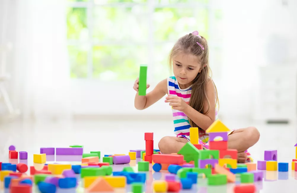 Girl playing with building blocks