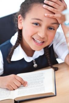 Girl reading at her desk