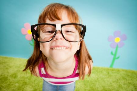 Girl wearing glasses and smiling