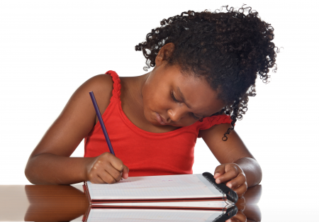 Girl writing in a notebook