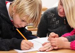 Mum helping child with work