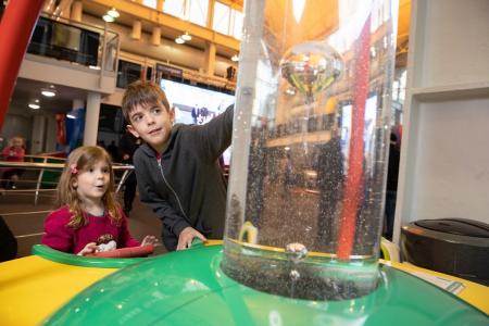 children exploring science museum and learning about STEM