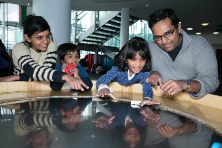 family enjoying a day out at the Techniquest museum