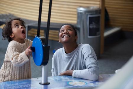 Child and parent enjoying the activities at We the Curious in Bristol 